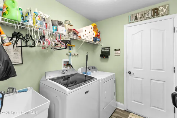 a utility room with dryer and washer