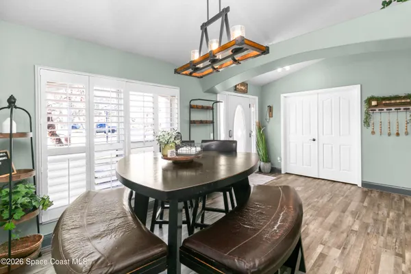 a view of a dining room with furniture window and outside view