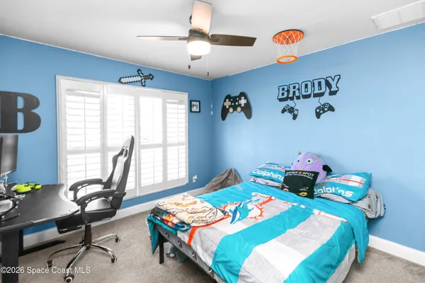 a bedroom with a bed and a table
