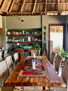a living room with furniture a rug and a table