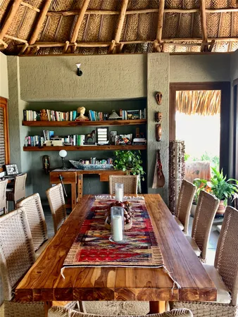 a living room with furniture a rug and a table
