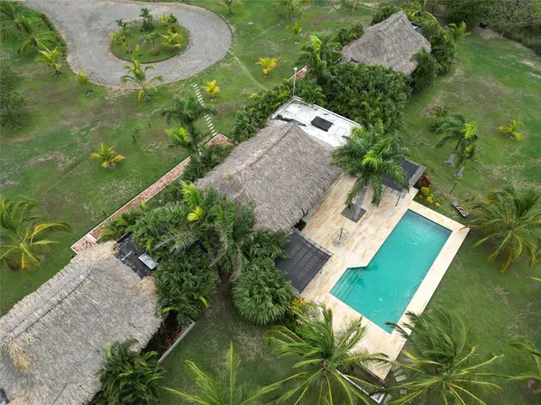 an aerial view of a house with a yard