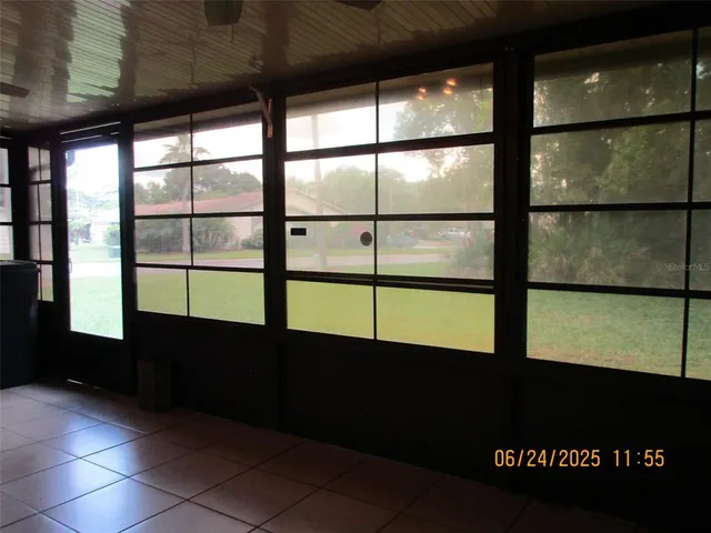 a view of an empty room with a large window