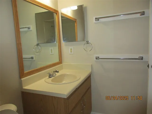 a bathroom with a sink and shower