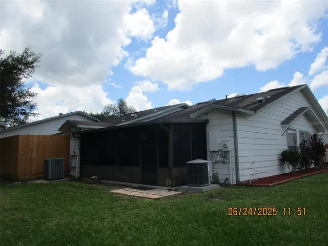 a backyard of a house with lots of green space
