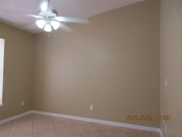 a view of a chandelier fan in a room