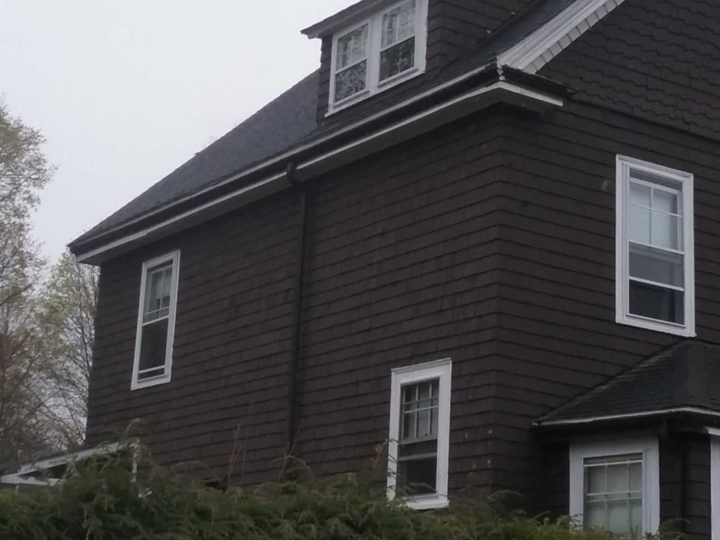 65 Prospect Street Wellesley, MA 02481 - Photo 15 of 25 a front view of a house with plants