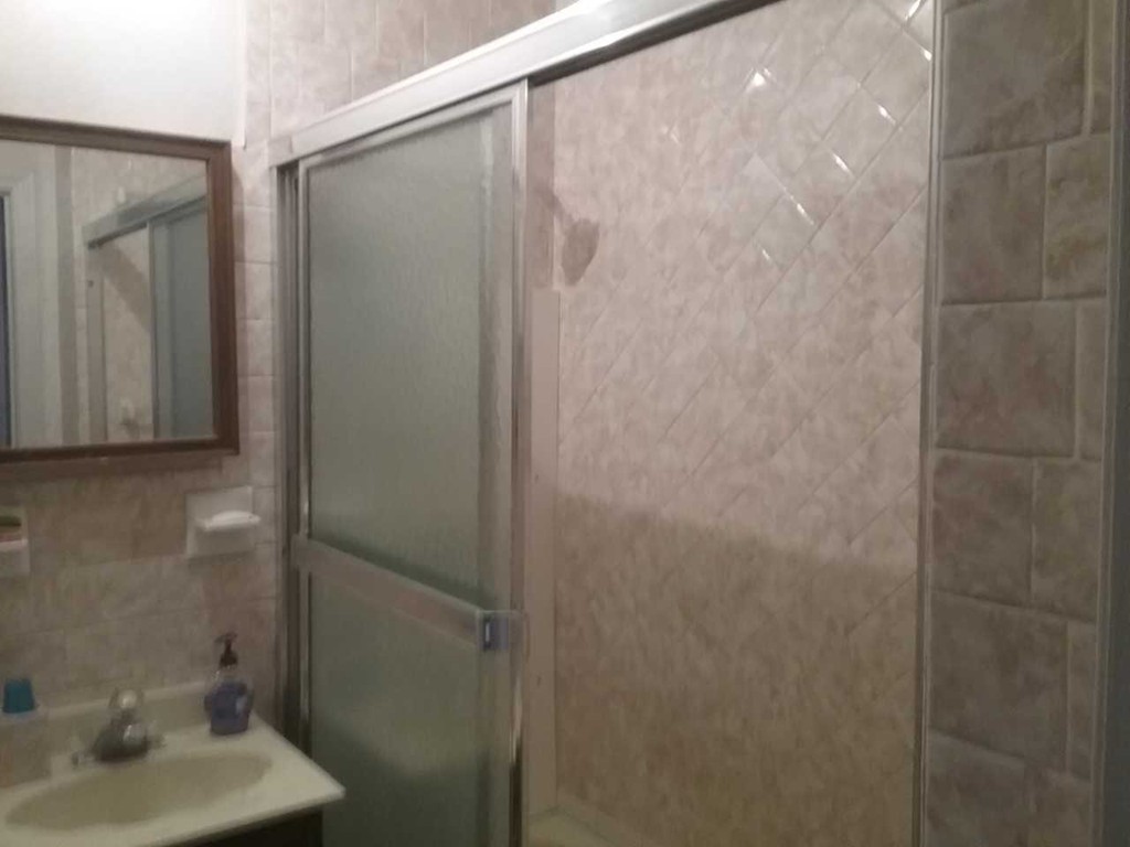 65 Prospect Street Wellesley, MA 02481 - Photo 9 of 25 a bathroom with a shower and a sink