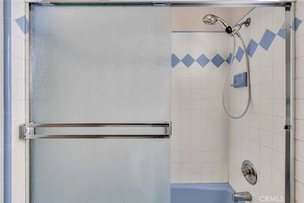 a bathroom with a sink and shower