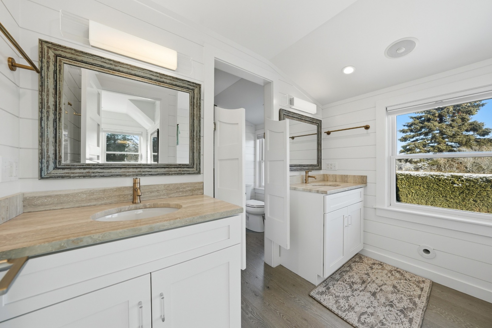 10 Pilgrim Road Nantucket, MA 02554 - Photo 37 of 65 a bathroom with a sink a mirror and a window