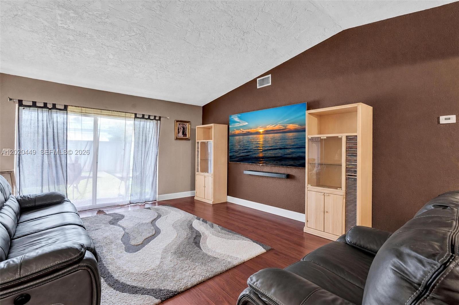 11061 Southwest 163rd Street Miami, FL 33157 - Photo 13 of 42 a living room with furniture and a open kitchen