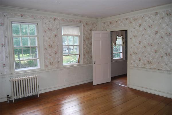 90 Nourse Road Ashby, MA 01431 - Photo 20 of 27 an empty room with wooden floor and windows