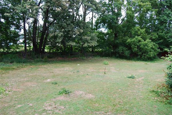 90 Nourse Road Ashby, MA 01431 - Photo 22 of 27 a view of a garden with trees in the background
