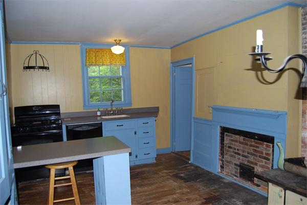 90 Nourse Road Ashby, MA 01431 - Photo 5 of 27 a kitchen with a refrigerator and a stove