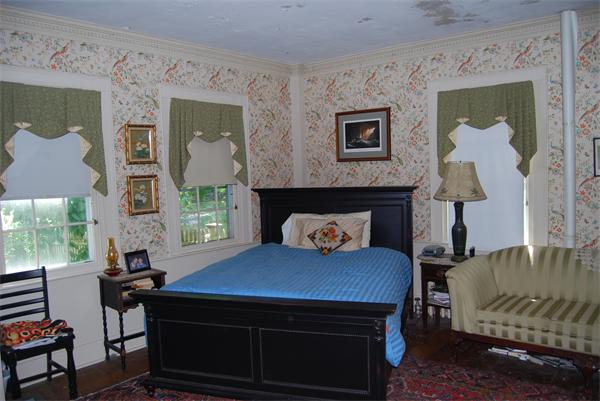 90 Nourse Road Ashby, MA 01431 - Photo 9 of 27 a living room with furniture and a fireplace