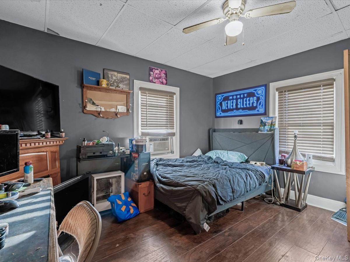 29 Parkside Avenue Miller Place, NY 11764 - Photo 12 of 14 a bedroom with a bed and a flat screen tv