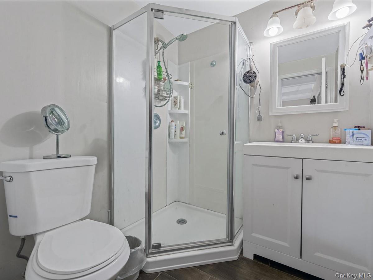 29 Parkside Avenue Miller Place, NY 11764 - Photo 13 of 14 a bathroom with a shower a toilet and sink
