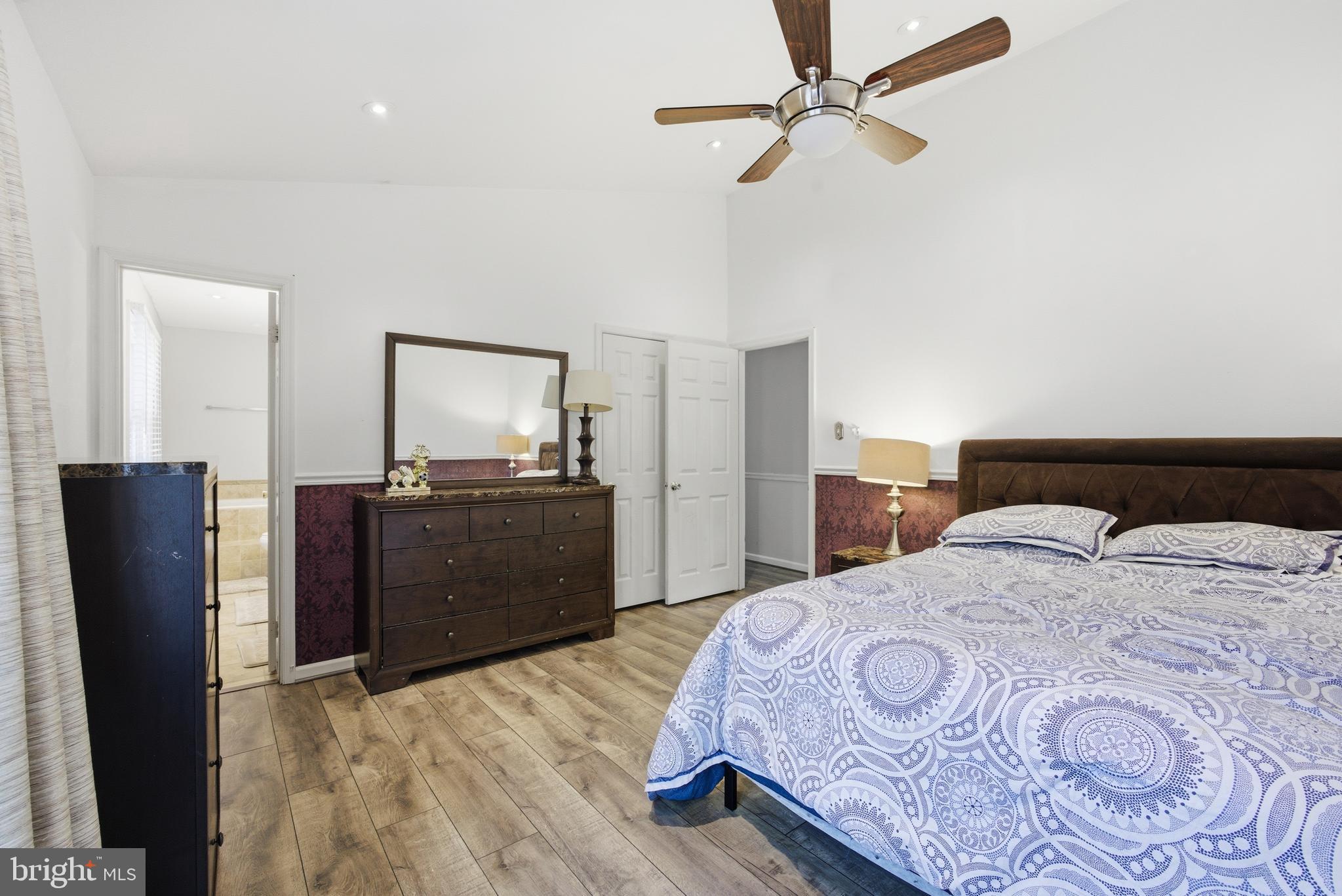 8664 Pohick Forest Court Springfield, VA 22153 - Photo 25 of 41 a bedroom with a bed and a television