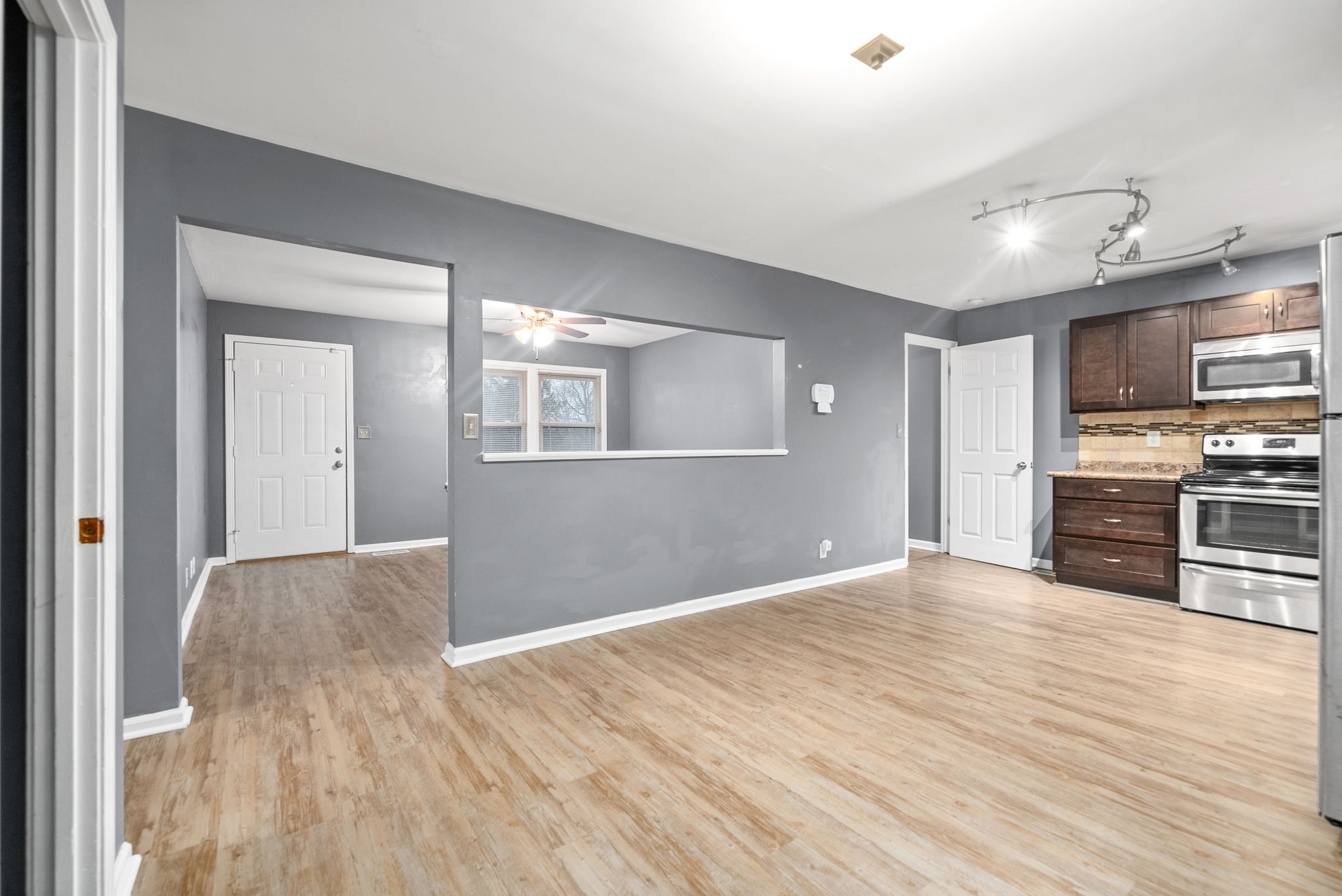 832 Pollard Road Clarksville, TN 37042 - Photo 12 of 30 a view of a kitchen with wooden floor and electronic appliances