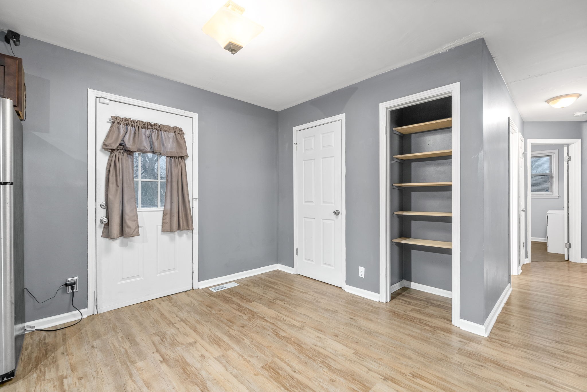 832 Pollard Road Clarksville, TN 37042 - Photo 13 of 30 a view of a livingroom with wooden floor and closet