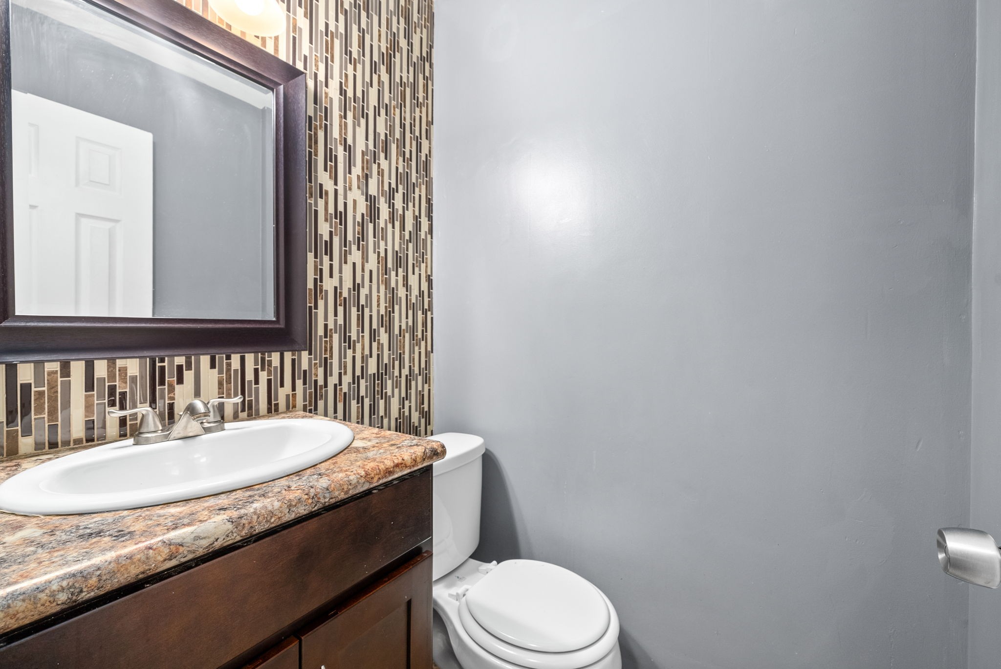 832 Pollard Road Clarksville, TN 37042 - Photo 15 of 30 a bathroom with a granite countertop toilet sink and mirror
