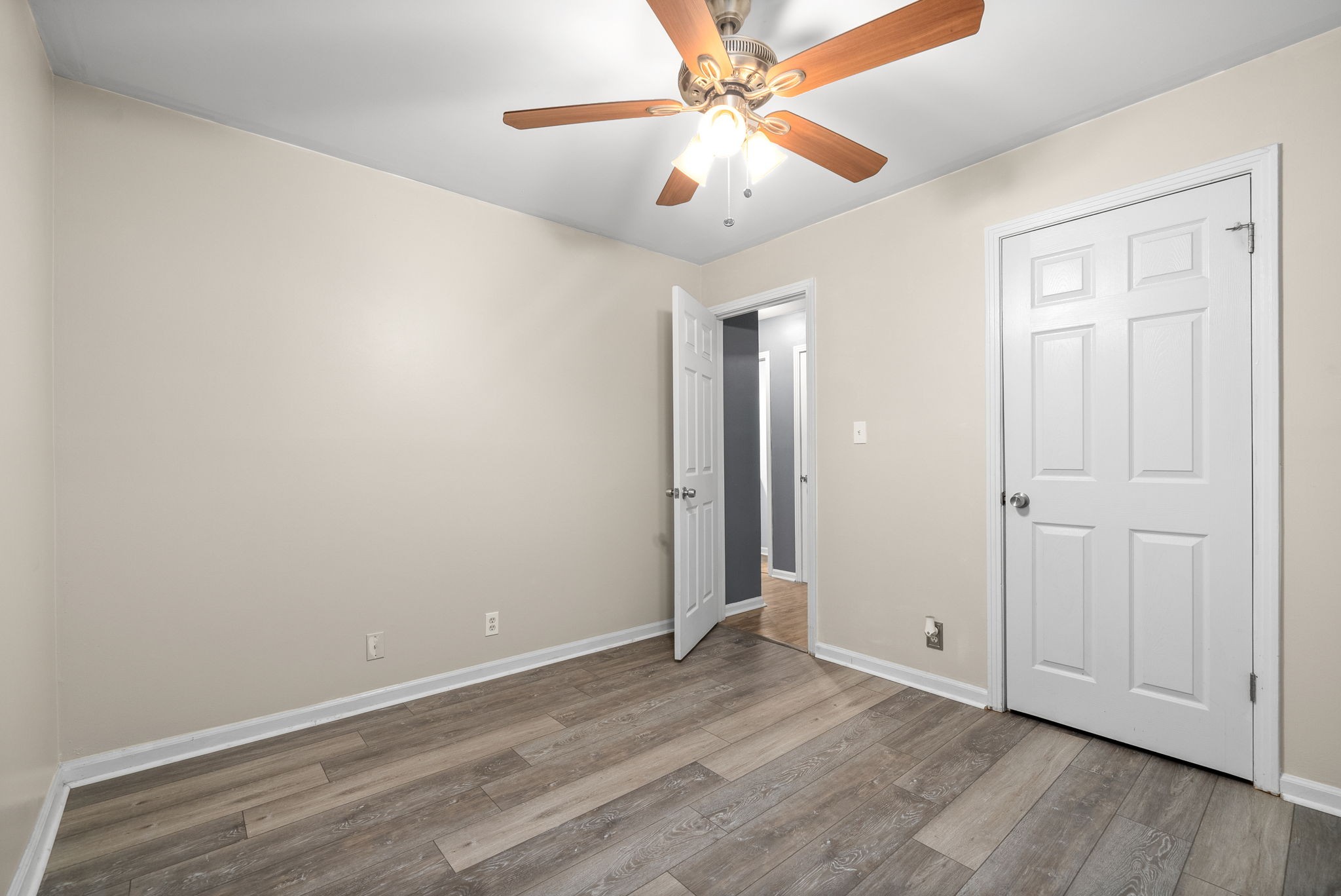 832 Pollard Road Clarksville, TN 37042 - Photo 17 of 30 an empty room with wooden floor fan and windows