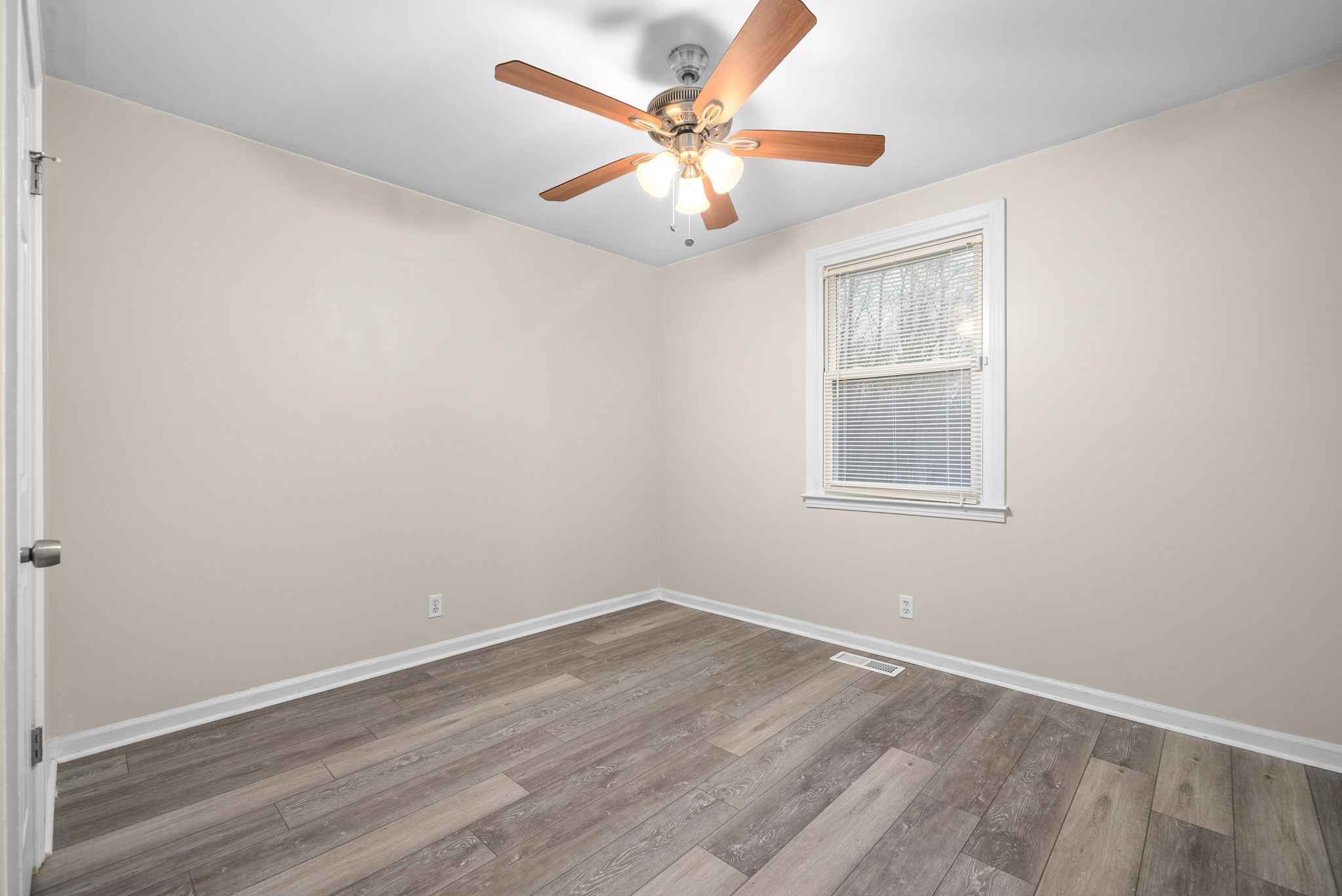 832 Pollard Road Clarksville, TN 37042 - Photo 18 of 30 an empty room with wooden floor and windows