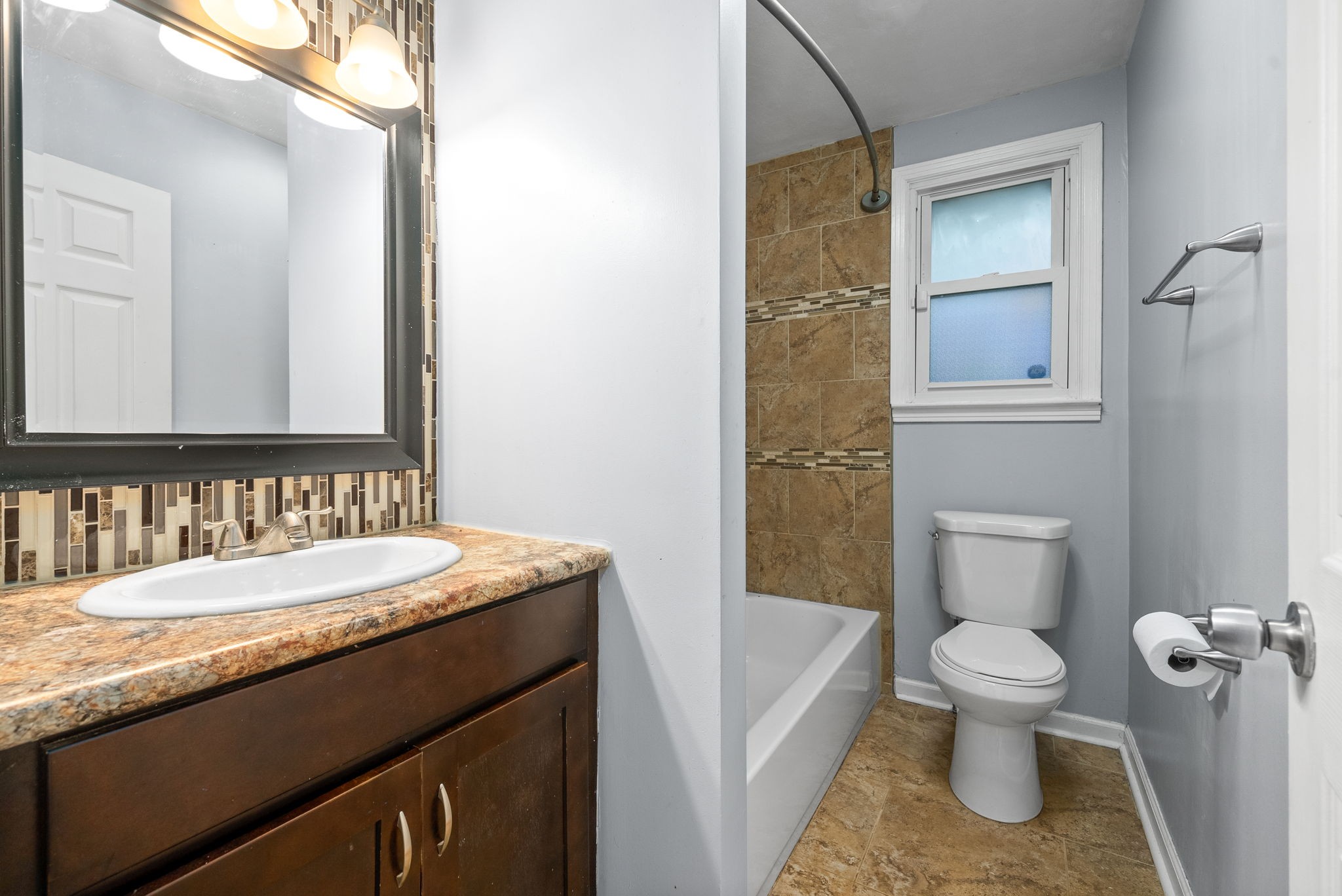 832 Pollard Road Clarksville, TN 37042 - Photo 19 of 30 a bathroom with a granite countertop sink toilet and shower