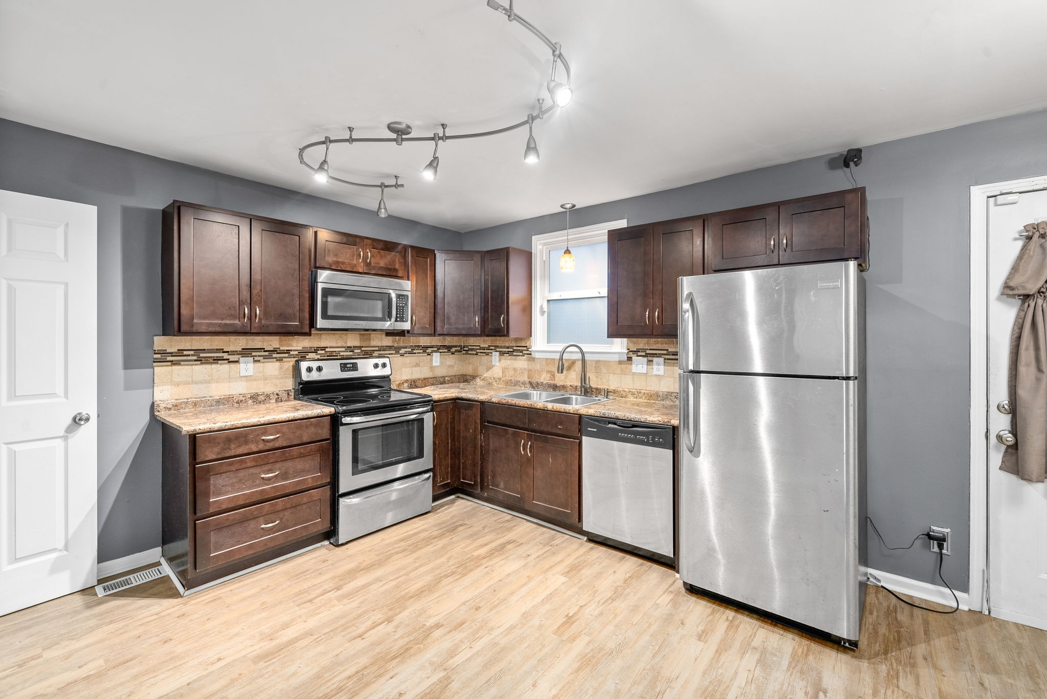832 Pollard Road Clarksville, TN 37042 - Photo 8 of 30 a kitchen with granite countertop stainless steel appliances and wooden cabinets