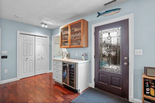 a view of kitchen with stainless steel appliances granite countertop a stove and a refrigerator