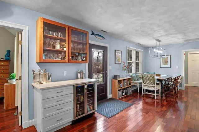 a view of a workspace with furniture and wooden floor