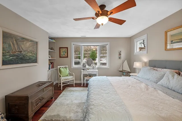 a spacious bedroom with a large bed and a window