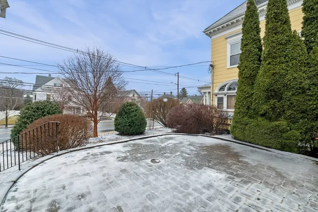a view of a street with a building in the background