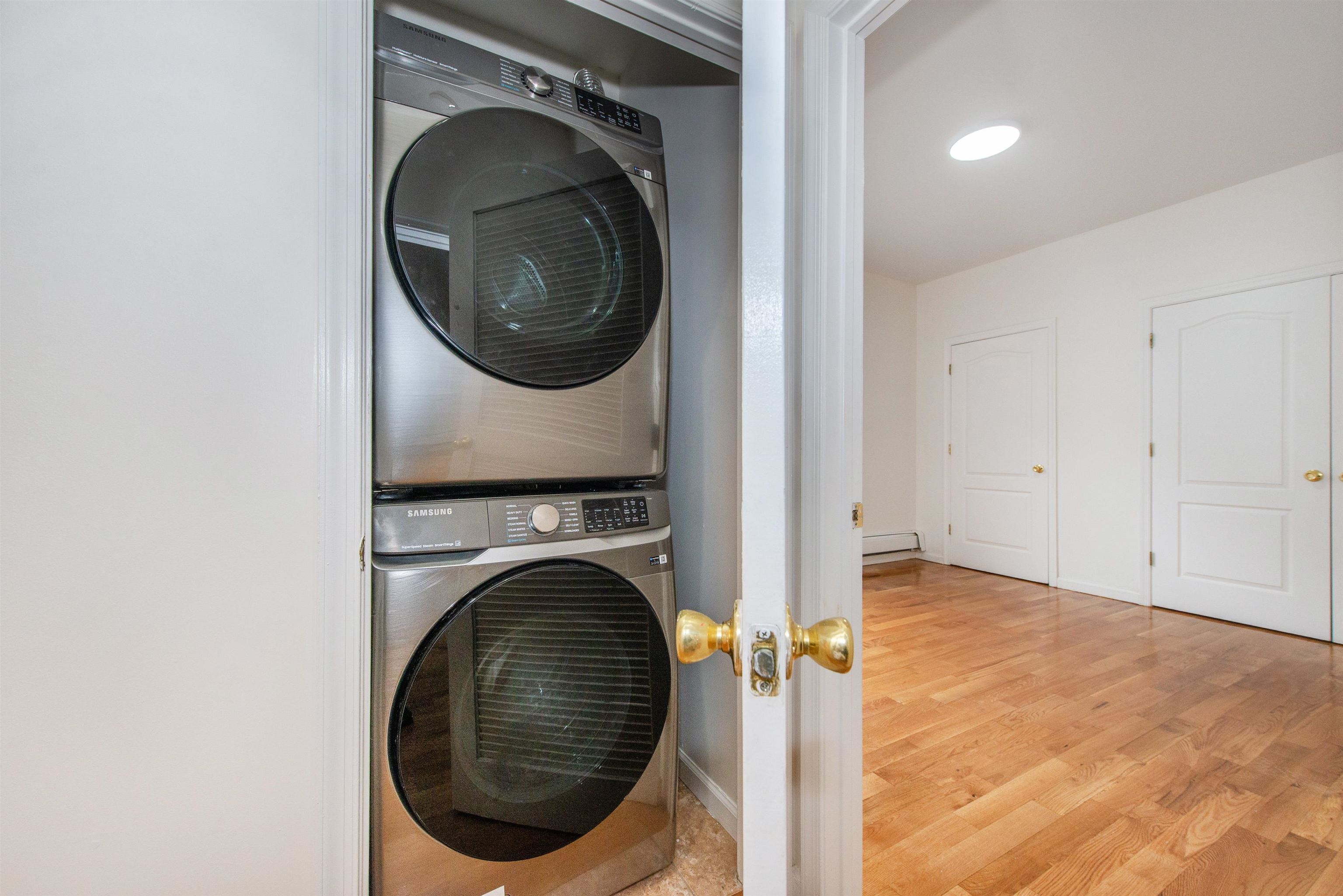 263 South 10th Street, Unit 2 Newark, NJ 07103 - Photo 9 of 22 a view of a hallway with washer and dryer