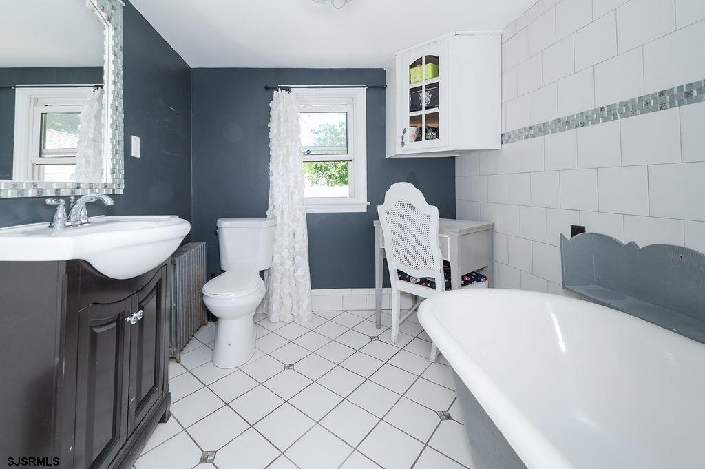19 South 1st Road Hammonton, NJ 08037 - Photo 25 of 36 a bathroom with a sink and a mirror