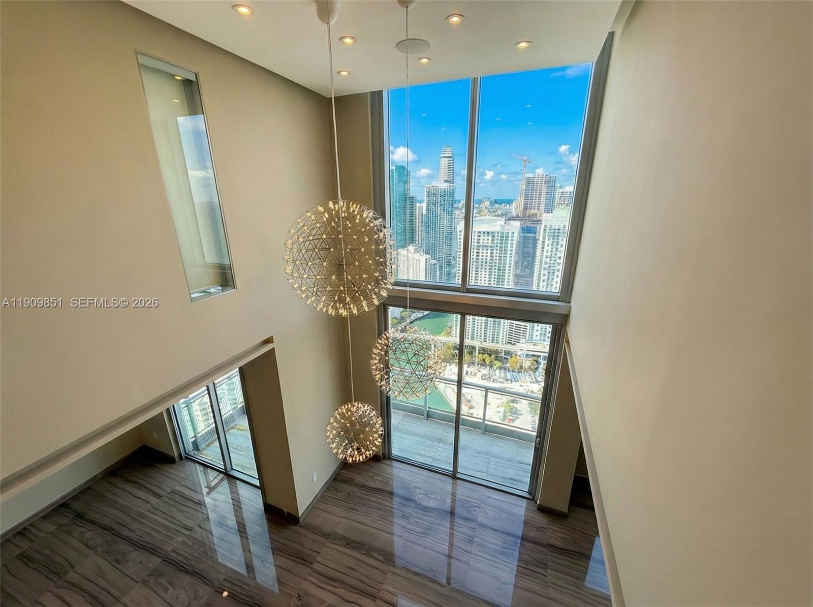 92 Southwest 3rd Street, Unit PH5213 Miami, FL 33130 - Photo 12 of 24 a view of entryway and hall with wooden floor