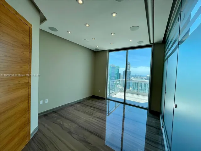a view of entryway with wooden floor