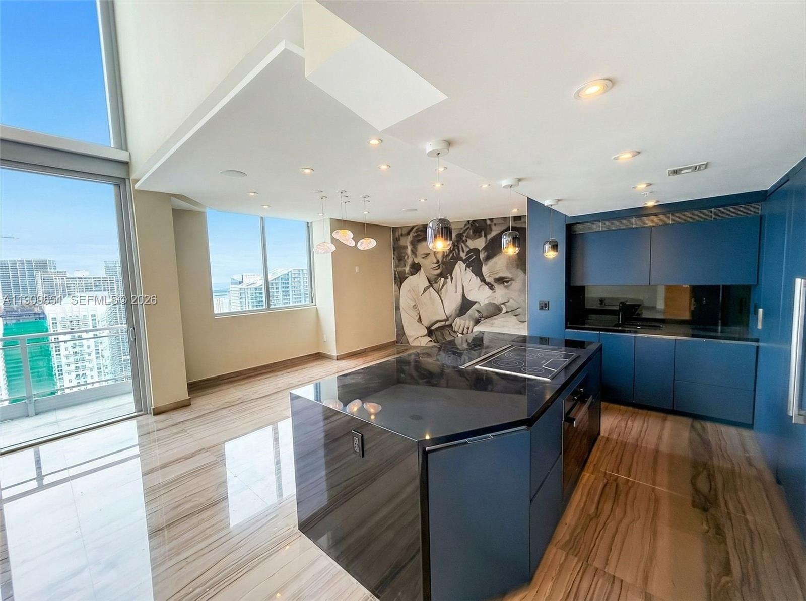 92 Southwest 3rd Street, Unit PH5213 Miami, FL 33130 - Photo 9 of 24 a kitchen with stainless steel appliances granite countertop a sink stove and refrigerator