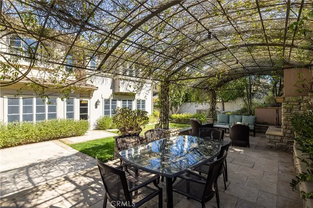 a view of a patio with a table and chairs