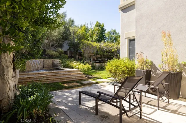 a view of a bench in the backyard