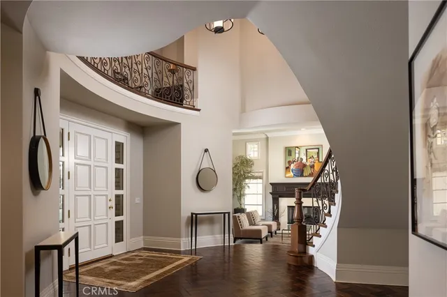 a view of living room and dining room with wooden floor
