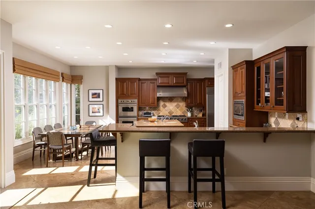 a kitchen with a table and chairs in it