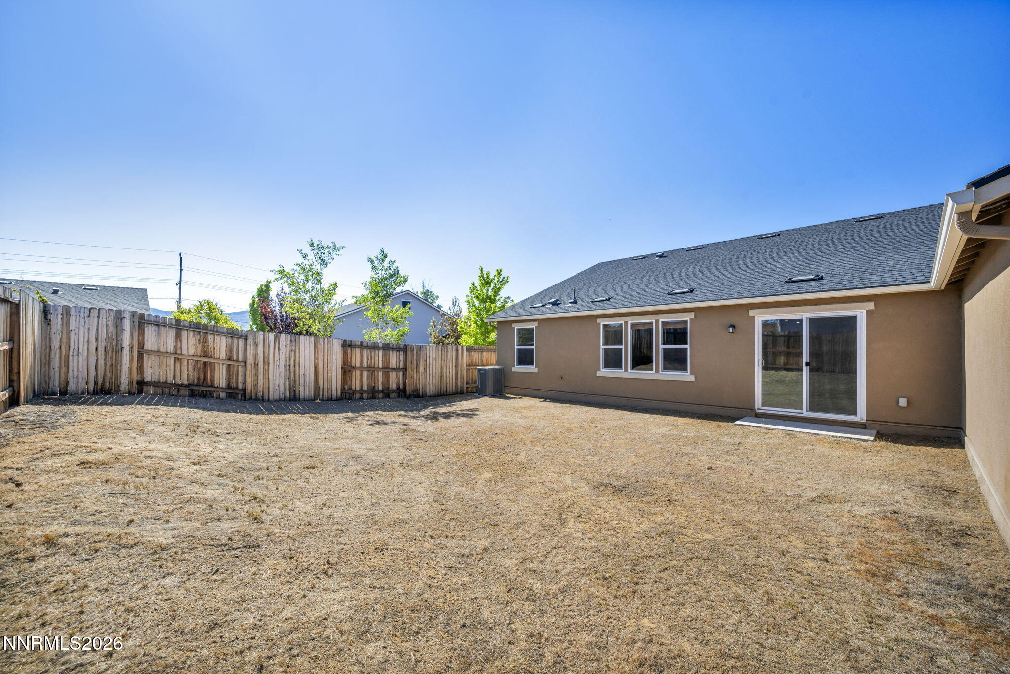 7181 Saddlehorn Road Carson City, NV 89701 - Photo 53 of 62 a view of a house with wooden fence