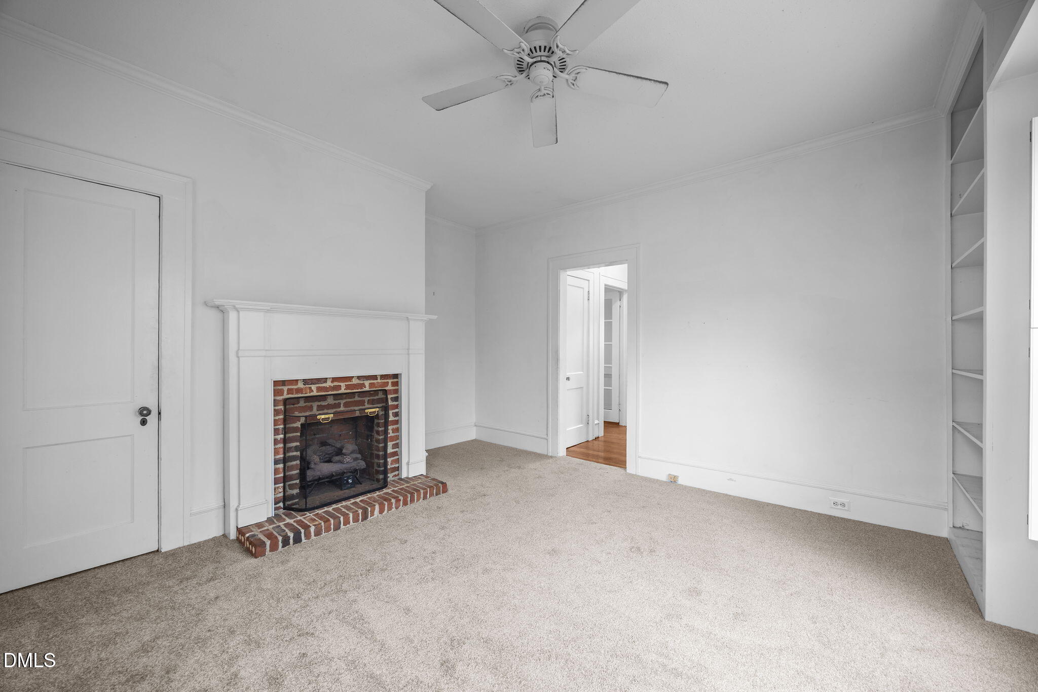 511 North Main Street Graham, NC 27253 - Photo 16 of 42 an empty room with fireplace and fan