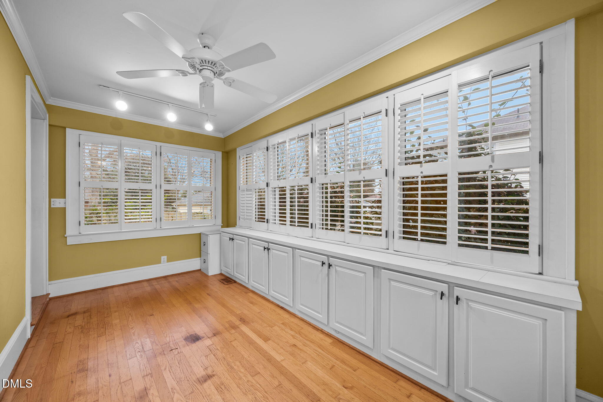 511 North Main Street Graham, NC 27253 - Photo 17 of 42 a view of an empty room with a window and wooden floor