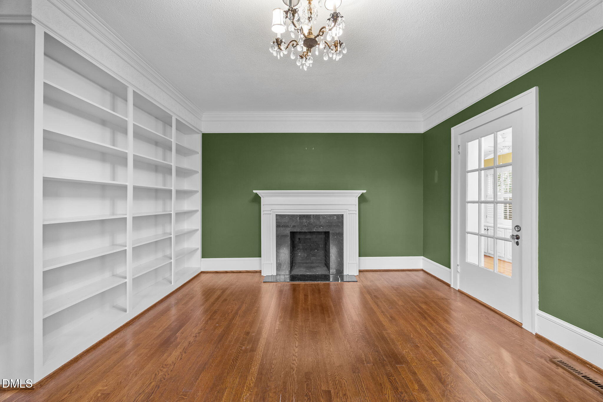 511 North Main Street Graham, NC 27253 - Photo 19 of 42 a view of an empty room with a window and fireplace
