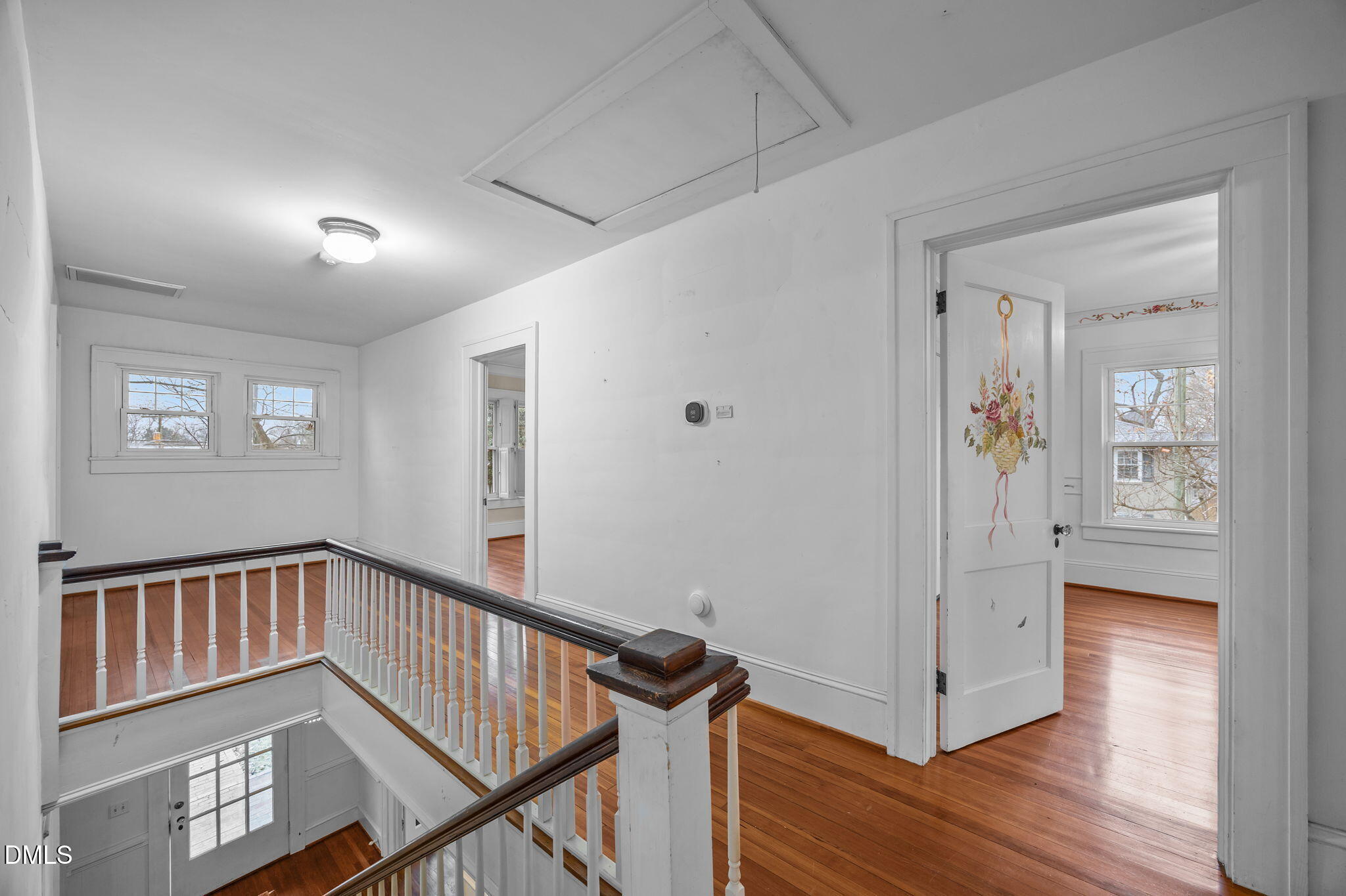 511 North Main Street Graham, NC 27253 - Photo 21 of 42 a view of a hallway with wooden floor and stairs