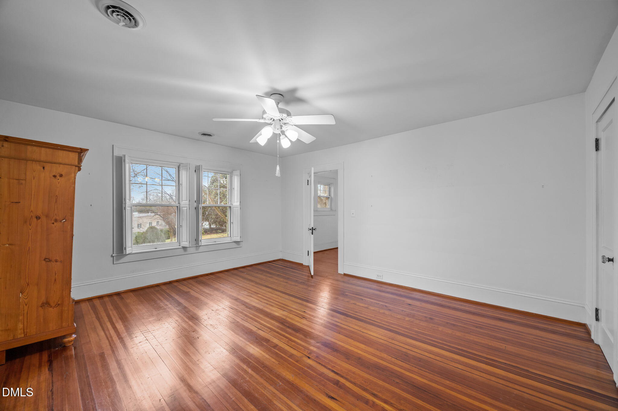 511 North Main Street Graham, NC 27253 - Photo 24 of 42 an empty room with wooden floor and windows