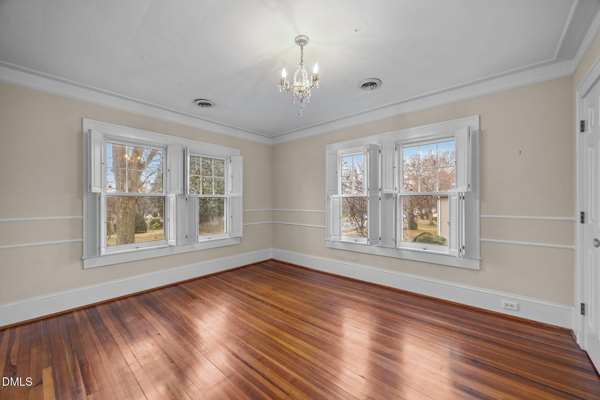 511 North Main Street Graham, NC 27253 - Photo 25 of 42 a view of an empty room with wooden floor and a window