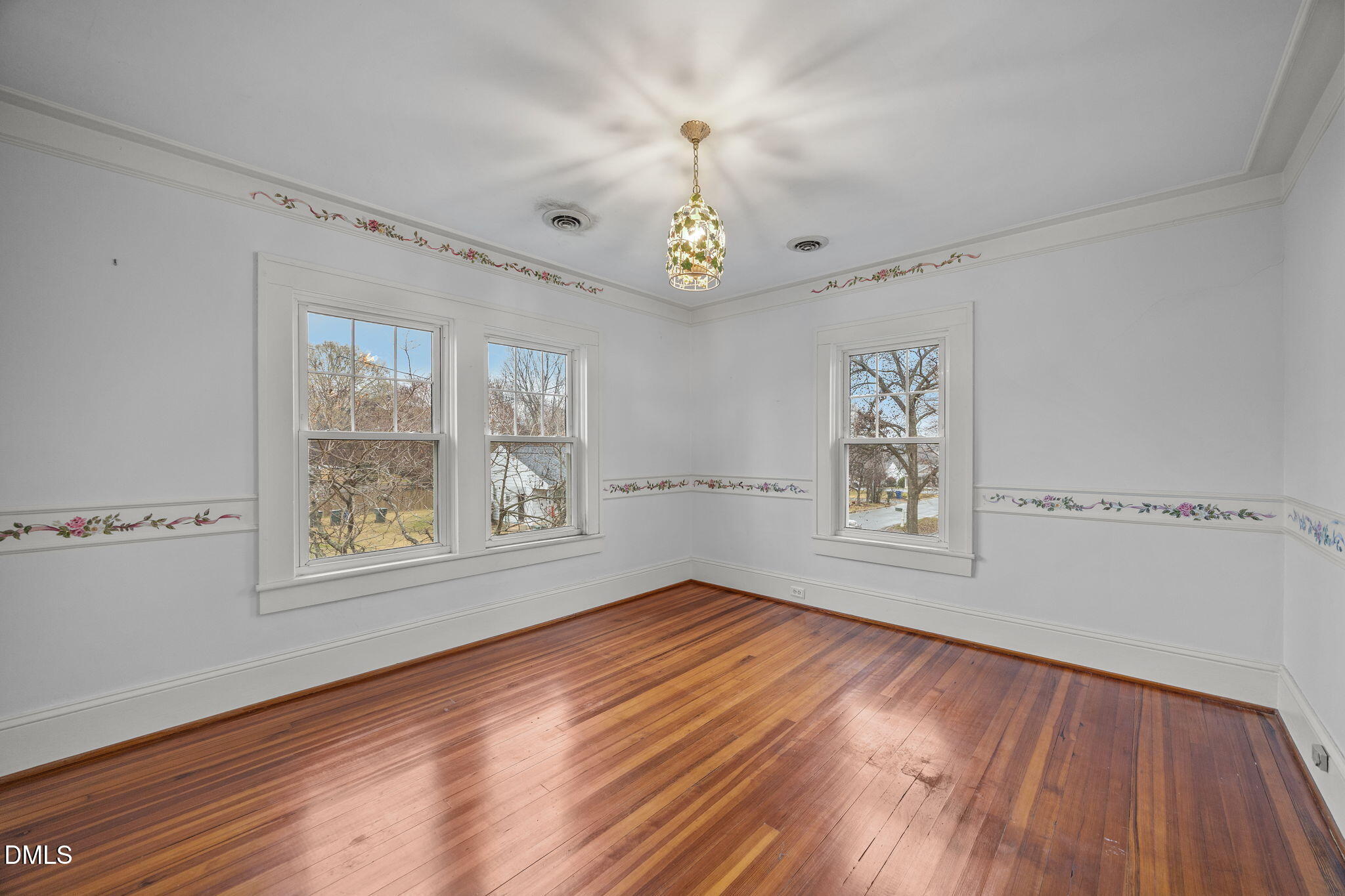 511 North Main Street Graham, NC 27253 - Photo 27 of 42 a view of an empty room with wooden floor and a window